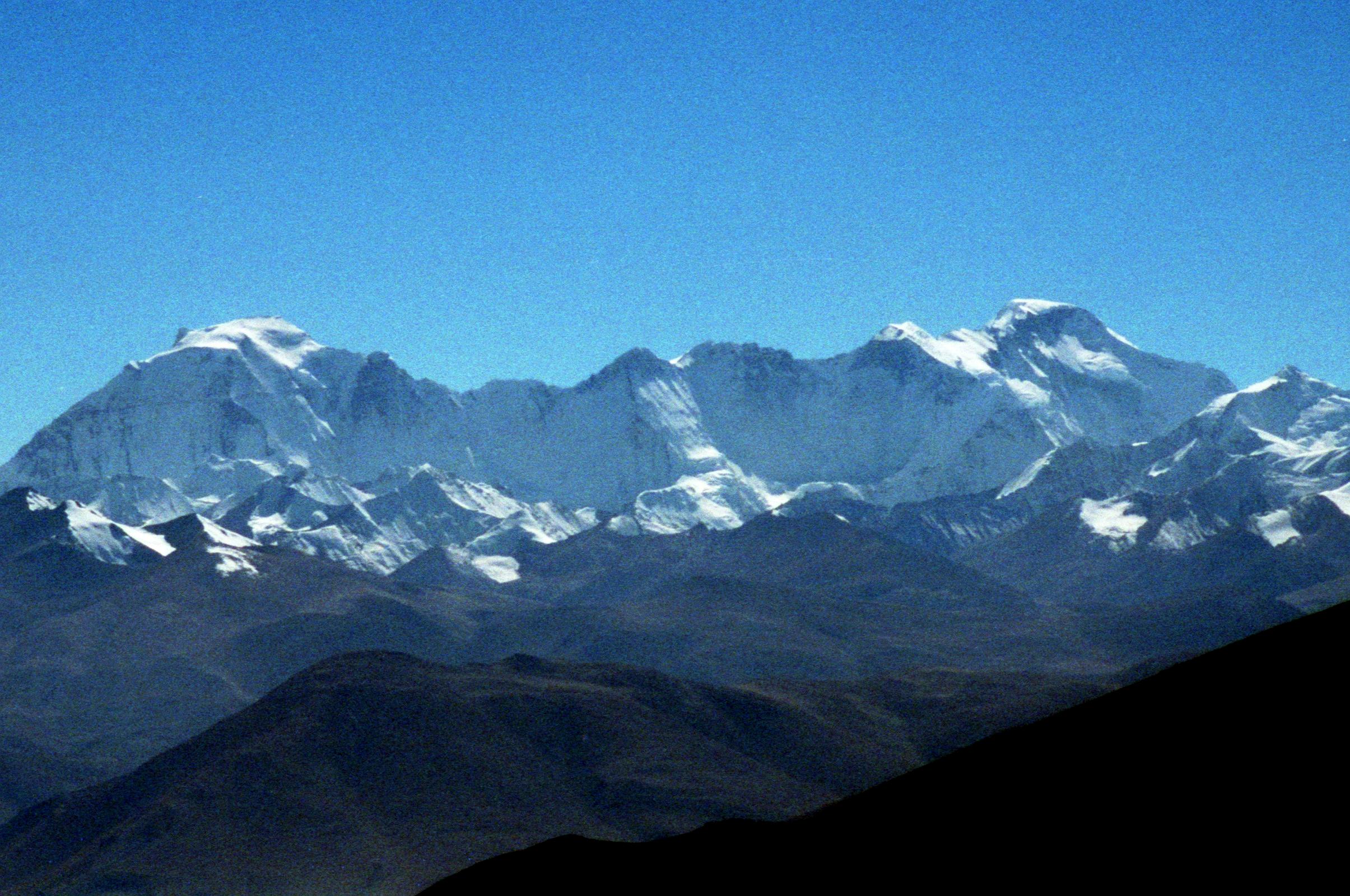 12 Gyachung Kang To Cho Oyu From Pang La Gyachung Kang (7952m) and Cho Oyu (8201m) close up from the Pang La (5250m) pass on the way to Everest North Face in Tibet.